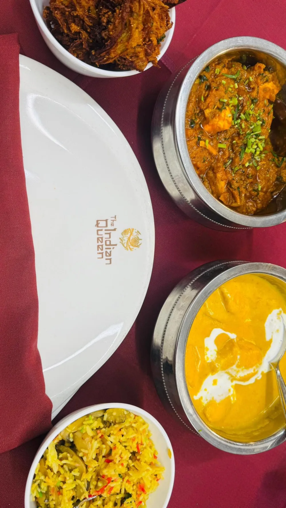 Indian banquet feast with curries, rice, tandoori dishes and accompaniments